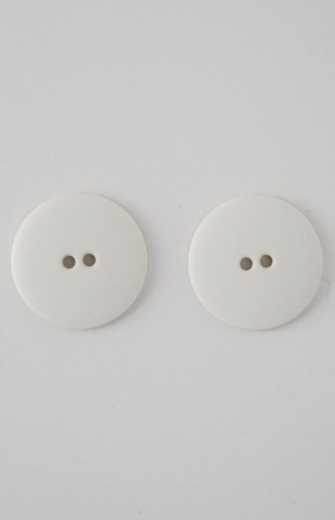 white plastic button